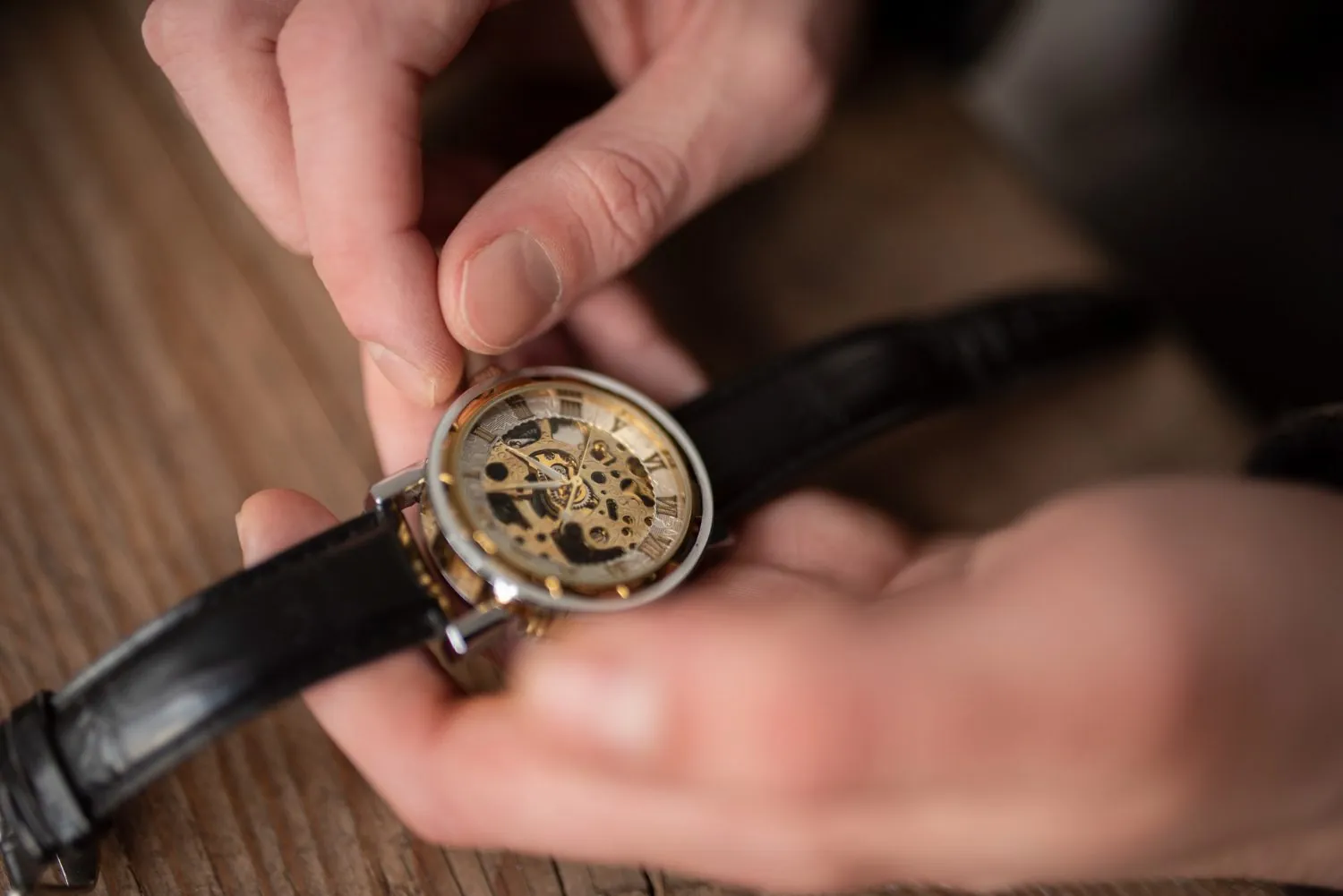 A watch case opened at the counter for a battery replacement