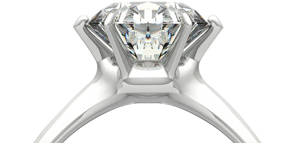 An engagement ring examined at the counter before any repair work begins