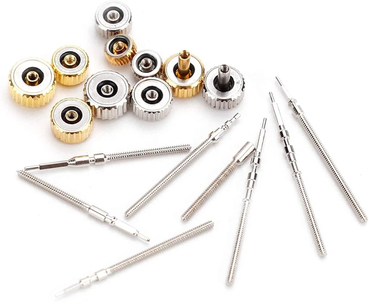 Watch band pins and spring bars laid out on the bench